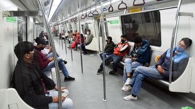 Passengers sit inside the Delhi Metro maintaining social distancing. (Prateek Kumar)