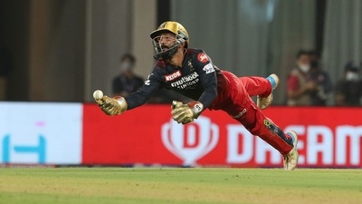 Dinesh Karthik of Royal Challengers Bangalore fails to hold on to an edge off Shikhar Dhawan's bat. (PTI) Dinesh Karthik of Royal Challengers Bangalore fails to hold on to an edge off Shikhar Dhawan's bat. (PTI)