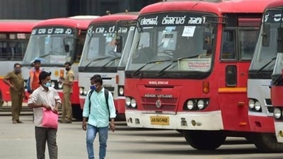 Passengers arrive to board buses at KSRTC bus stand at Devanahalli near Bengaluru. (PTI) Passengers arrive to board buses at KSRTC bus stand at Devanahalli near Bengaluru. (PTI)