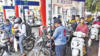 Motorcyclists wait in queues to get their vehicles filled with fuel, at a petrol pump in Navi Mumbai. (PTI file)