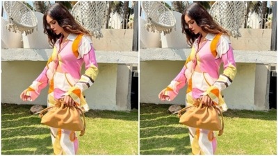Gabriella kickstarted summer with a full-sleeved shirt unbuttoned from the waist and teamed it with a pair of trousers of the same print with wide legs. (Instagram/@gabriellademetriades)