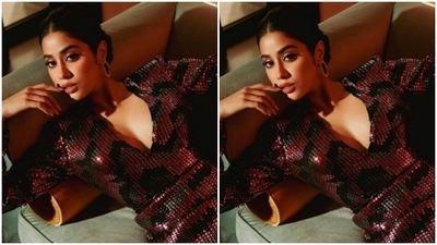 Janhvi’s midriff-baring embellished dress came with full sleeves and a thigh-high slit. Janhvi posed in a couch like a queen for the cameras. (Instagram/@janhvikapoor)