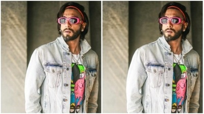 Ranveer further accessorised his look for the day with tinted shades with pink frame and a red hairband holding his hair in place. (Instagram/@ranveersingh)
