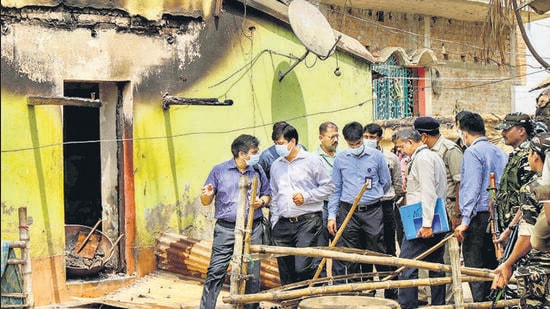 Birbhum: Central Forensic Science Laboratory's (CFSL) experts collect samples in presence of CBI officers from the houses, where eight people were burned alive allegedly to avenge the killing of TMC leader Bhadu Sheikh, at Bogtui village in Birbhum district, Saturday, March 26, 2022. (PTI Photo)(PTI03_26_2022_000107A) (PTI)