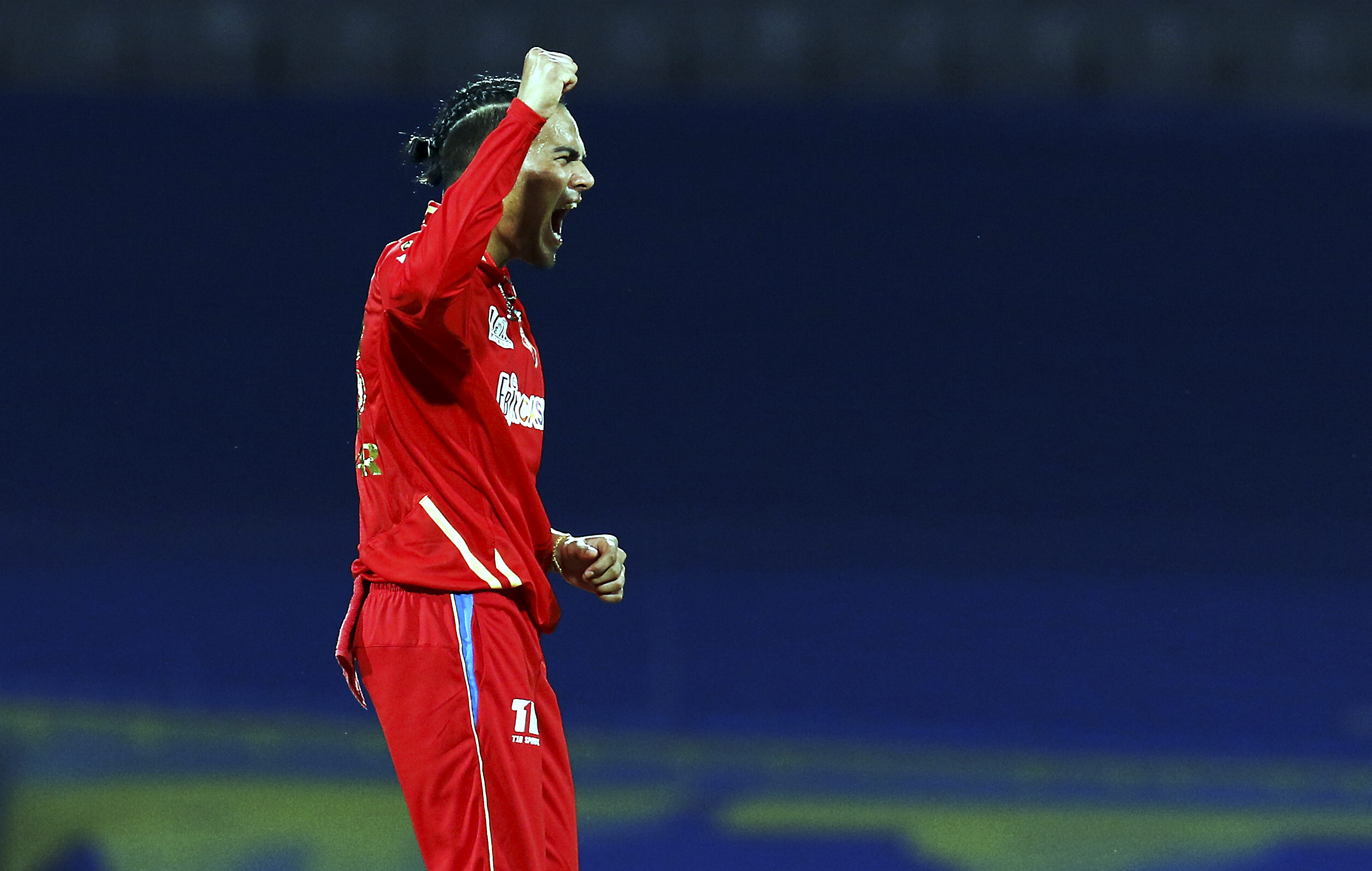 Rahul Chahar of Punjab Kings celebrates the wicket of Anuj Rawat of Royal Challengers Bangalore Rahul Chahar of Punjab Kings celebrates the wicket of Anuj Rawat of Royal Challengers Bangalore