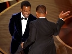 Will Smith hits at Chris Rock as Rock spoke on stage during the 94th Academy Awards in Hollywood, Los Angeles, California, U.S., March 27, 2022. REUTERS/Brian Snyder