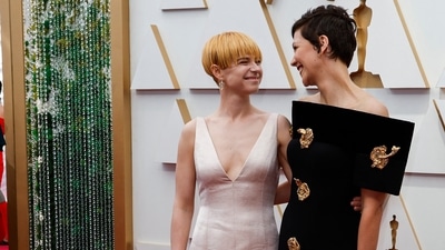 Jessie Buckley, nominated for Best Supporting Actress for the film The Lost Daughter, poses with the film's writer and director Maggie Gyllenhaal on the red carpet during the Oscars ceremony. (REUTERS)