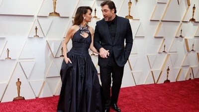 Penelope Cruz and husband Javier Bardem were couple goals on the Oscars red carpet. Penelope stepped out in a custom long taffeta Chanel dress with an open back, while Javier selected a monochromatic tux for their big night out. Her gown was inspired by Chanel's Haute Couture Fall-Winter 2020/21 collection. (REUTERS)