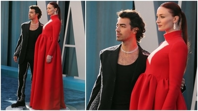 Meanwhile, Joe complemented his pregnant wife in a black and white abstract embellished suit from Louis Vuitton. He wore a sleek and modern notch lapelled blazer adorned with shiny silver diamantes with matching pants. (Reuters) Meanwhile, Joe complemented his pregnant wife in a black and white abstract embellished suit from Louis Vuitton. He wore a sleek and modern notch lapelled blazer adorned with shiny silver diamantes with matching pants. (Reuters)