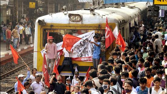 Supporters of Left Trade Unions block the railway tracks at Jadavpur railway station as a part of the two-day nationwide strike 'Bharat Bandh' against the Centre over its policies allegedly affecting farmers and workers, in Kolkata on Monday. (ANI)