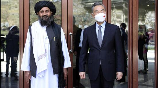 Chinese foreign minister Wang Yi (right) with Mullah Abdul Ghani Baradar, acting deputy prime minister of the Afghan Taliban’s caretaker government, in Kabul, Afghanistan on March 24, 2022. (AP)