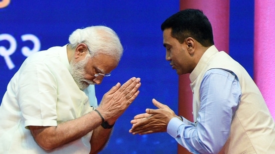 Prime Minister Narendra Modi congratulates the newly sworn-in Goa chief minister Pramod Sawant in Panaji on March 28, 2022.&nbsp;(ANI Photo)