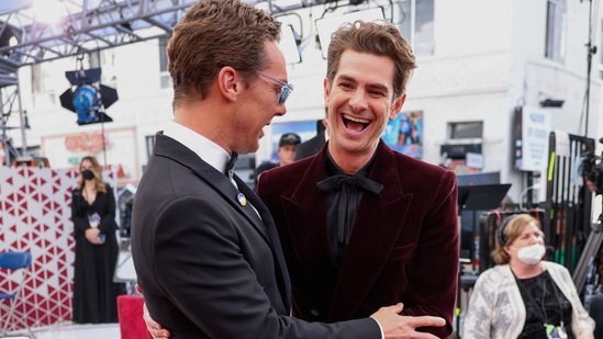Benedict Cumberbatch and Andrew Garfield share a candid moment on the Oscars' red carpet. Both the actors looked dapper in their tuxedos.&nbsp;(REUTERS)