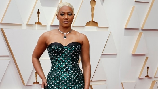 Tiffany Haddish strutted the Oscars red carpet in an emerald green embellished custom gown by Dolce and Gabbana. She paired it with a coordinated necklace and sparkling earrings.(REUTERS)