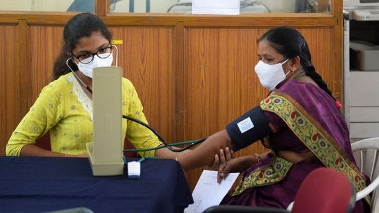 A doctor checks the blood pressure of a patient.(AFP file photo)