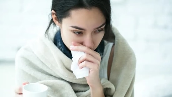 Some people may have a lingering cough or other symptoms when they're past the normal infectious period.(Shutterstock)