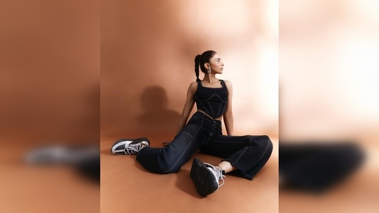 Rakul Preet teamed her outfit with a pair of black, grey and white sneakers that complemented her streetwear pretty well.(Instagram/@rakulpreet)