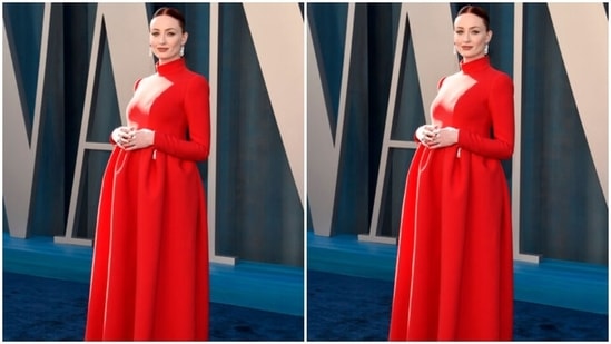 Sophie's bright red floor-length gown features long sleeves, fitted bodice, pleated floor-grazing skirt, a high neckline for a streamlined appearance, and white contrast lining on the side. The pregnant star complemented her deep-red hair with the ensemble.(Reuters)