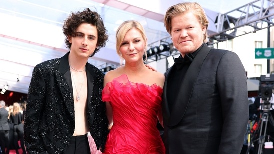 Timothee Chalamet, Kirsten Dunst and Jesse Plemons posed on the red carpet during the Oscars arrivals in a striking outfit. Timothee made headlines with his shirtless look in an embellished jacket and black pants. Kristen looked lovely in a pink ball gown, and Jesse rocked a dapper look in a simple black tuxedo.
