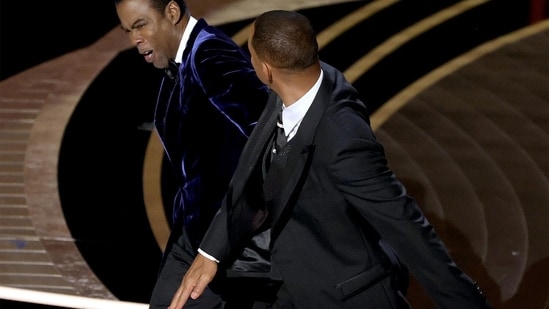 Will Smith and Chris Rock on stage at the Oscars.