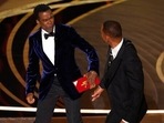 Chris Rock reacts after being hit on stage by Will Smith. Chris Rock reacts after being hit on stage by Will Smith.