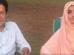 A file photo of Imran Khan with his wife Bushra Maneka