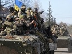 Ukrainian soldiers ride a tank through the town of Trostsyanets, some 400km eastern of capital Kyiv. (AP) Ukrainian soldiers ride a tank through the town of Trostsyanets, some 400km eastern of capital Kyiv. (AP)