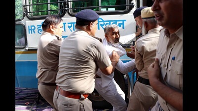 Police arresting employees of Haryana Roadways at the new bus stand in Rohtak on Tuesday. (Manoj Dhaka/HT) Police arresting employees of Haryana Roadways at the new bus stand in Rohtak on Tuesday. (Manoj Dhaka/HT)
