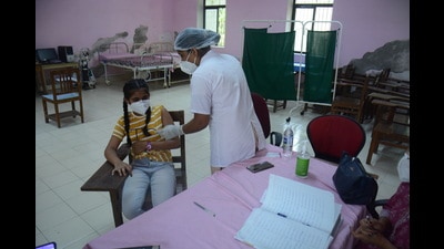 A beneficiary in the 12-15 years age group being vaccinated against Covid in Thane on Tuesday. (PRAFUL GANGURDE/HT PHOTO)