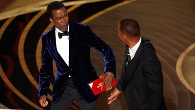 Chris Rock reacts after being hit on stage by Will Smith. (Chris Pizzello/Invision/AP) Chris Rock reacts after being hit on stage by Will Smith. (Chris Pizzello/Invision/AP)