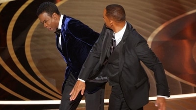 Will Smith hits Chris Rock as he spoke on stage. (REUTERS) (REUTERS)