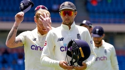 Joe Root leads his team off the field after losing against West Indies (AP) Joe Root leads his team off the field after losing against West Indies (AP)