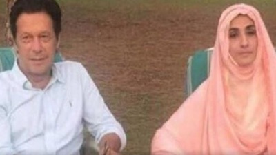 A file photo of Imran Khan with his wife Bushra Maneka