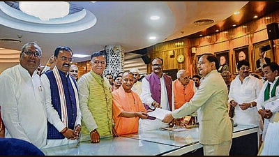 BJP MLA Satish Mahana (3L) filing his nomination for the post of Speaker of Uttar Pradesh legislative assembly, in the presence of state CM Yogi Adityanath. (FILE PHOTO) BJP MLA Satish Mahana (3L) filing his nomination for the post of Speaker of Uttar Pradesh legislative assembly, in the presence of state CM Yogi Adityanath. (FILE PHOTO)