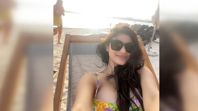 Mouni Roy puts on her big black shades and takes a selfie with the sun and the beach in the backdrop. (Instagram/@imouniroy) Mouni Roy puts on her big black shades and takes a selfie with the sun and the beach in the backdrop. (Instagram/@imouniroy)