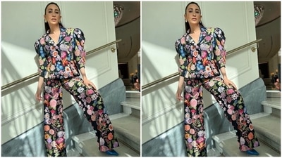 Karisma wore the jacket with matching pants set embroidered with floral patterns. The flared fitting and high waistline lent retro vibes to the star's look. She wore the ensemble with bright blue pointed high heels, patterned gold earrings, and rings. (Instagram/@stylebyami) Karisma wore the jacket with matching pants set embroidered with floral patterns. The flared fitting and high waistline lent retro vibes to the star's look. She wore the ensemble with bright blue pointed high heels, patterned gold earrings, and rings. (Instagram/@stylebyami)