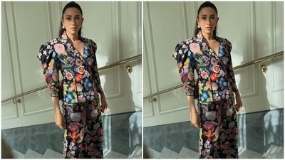 Karisma took to Instagram to post pictures of her floral look and captioned them, "Stay wild, Flower child." She wore a black-coloured quirky blazer and pants set for the event and teamed it with simple accessories. (Instagram/@stylebyami) Karisma took to Instagram to post pictures of her floral look and captioned them, "Stay wild, Flower child." She wore a black-coloured quirky blazer and pants set for the event and teamed it with simple accessories. (Instagram/@stylebyami)