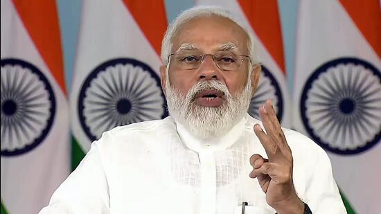 Prime Minister Narendra Modi addressed the Griha-Pravesham programme of beneficiaries in 5.21 lakh houses constructed under the Pradhan Mantri Awas Yojana in Madhya Pradesh on Tuesday. (ANI)