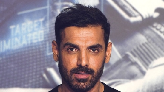 John Abraham poses for pictures during the trailer launch of Attack.(AFP)