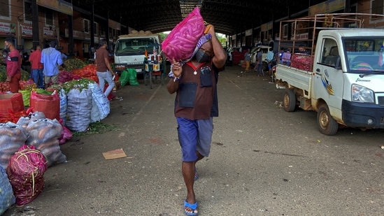 A worker carries a sack of vegetables towards a truck at the economic center in Dambulla, Sri Lanka February 15, 2022. Picture taken February 15, 2022. REUTERS/Devjyot Ghoshal(REUTERS)