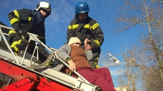 Firefighters rescue a person from a damaged five-storey building after a shelling in the city of Severodonetsk, Luhansk region, Ukraine.(via REUTERS)