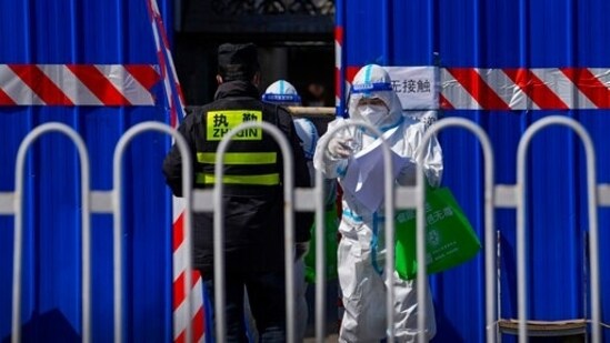 A health worker wearing a protective suit in Beijing, China.((AP Photo/Andy Wong))