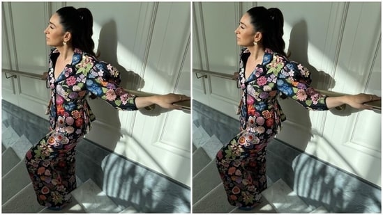 Karisma's ensemble is made from jacquard fabric. Her blazer comes adorned in floral embroidery done in vibrant shades, and features notch lapel collars, raised shoulders, gathered cuffs, quarter length sleeves, front button closures, a fitted silhouette, and a cropped length.(Instagram/@stylebyami)