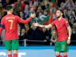 Portugal's Bruno Fernandes celebrates scoring their second goal with Cristiano Ronaldo.