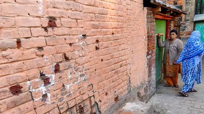 Women near the site of an encounter in which two LeT militants were killed, at Rainawari in Srinagar, on Wednesday. (PTI)