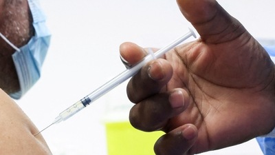FILE PHOTO: A man receives a booster dose of Pfizer's coronavirus disease. (REUTERS)