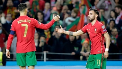 Portugal's Bruno Fernandes celebrates scoring their second goal with Cristiano Ronaldo. (REUTERS)