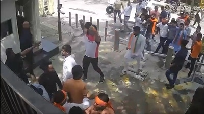 The footage from a CCTV camera installed at the Delhi CM residence shows the protesters dismantling barricades as they huddled outside the house. (Source: AAP Twitter) The footage from a CCTV camera installed at the Delhi CM residence shows the protesters dismantling barricades as they huddled outside the house. (Source: AAP Twitter)