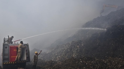 Firefighters douse a fire at the Ghazipur landfill site, in on Tuesday. (Ajay Aggarwal /HT) Firefighters douse a fire at the Ghazipur landfill site, in on Tuesday. (Ajay Aggarwal /HT)