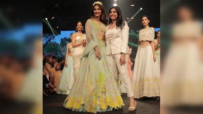 In another still, Keerthi Kadire can be seen ending her display of collection walking hand-in-hand with the showstopper Pooja Hegde. (Instagram/@keerthikadireofficial) In another still, Keerthi Kadire can be seen ending her display of collection walking hand-in-hand with the showstopper Pooja Hegde. (Instagram/@keerthikadireofficial)